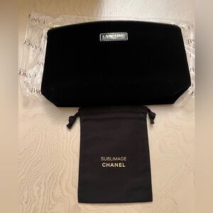 Cosmetic bags by Lancôme and Chanel for storage travel work